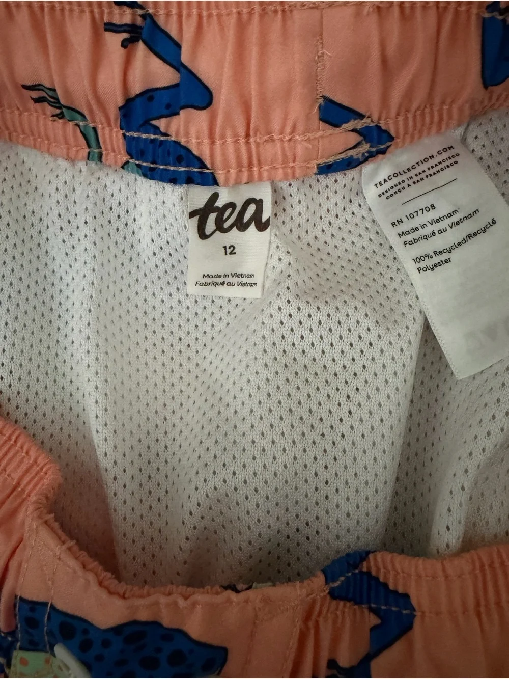 Tea Collection Peach Swim Trunks with Blue & Aqua Frog Print
